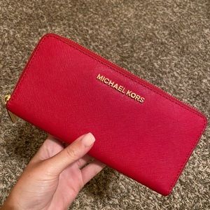 Red Michael Kors wallet.